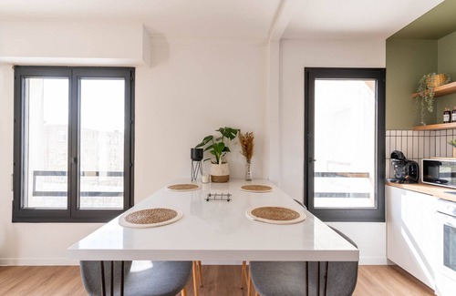 Cergy Apartment | Designer Apartment with Balcony & Private Parking Awaits