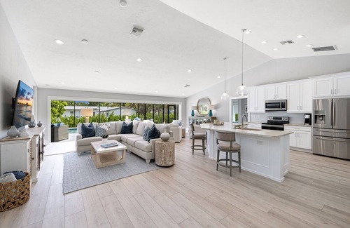Central Naples House | Chic Designer Pool Home in Naples by Oceanfront Beaches