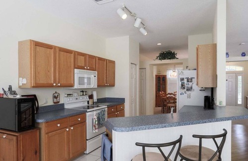 Regency Oaks House | Idyllic Lakefront Retreat with Private Pool at Regency Oaks