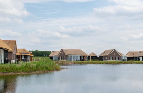 Municipality of Geldrop-Mierlo Ski Chalet | Cozy Chalet Retreat with Pool Near Eindhoven