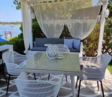 Vourvourou House | Dimitra's House: Oceanfront Escape with a 9.6 Rating