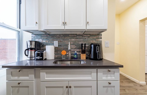 New Rochelle Apartment | Modern Luxe Retreat Near NYC with Spa & Hot Tub Access