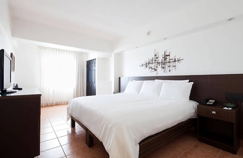 San Jose Hotel | Experience Unique Bandstand at Parque Central with Free Parking!