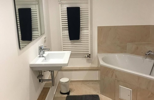 Strande Apartment | Beachside Retreat: Steps from Sand & Promenade with Pool