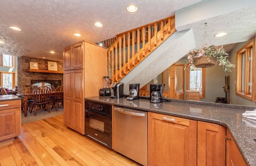 McHenry House | Majestic Lodge: Lakefront Retreat with Hot Tubs & Spa