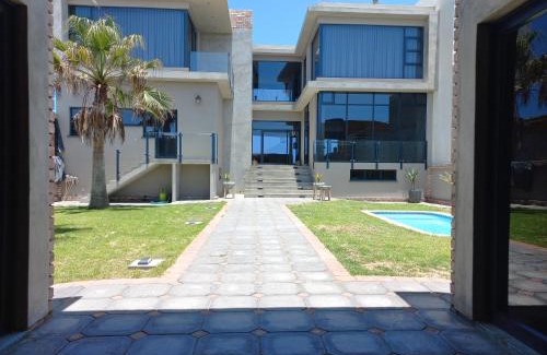 Rand Rifles Villa | Oceanfront Dolphin Beach Villa with Pool & Unbeatable Views
