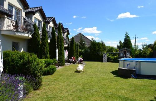 Dziwnowek House | Cozy Dom Aurora: Family-Friendly Rooms by the Sea