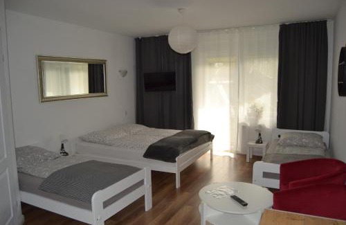 Dziwnowek House | Cozy Dom Aurora: Family-Friendly Rooms by the Sea