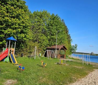 Wdzydze Tucholskiez Resort | Pet-Friendly Domki nad Kukówkiem with Oceanfront Views