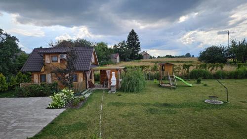 gmina Sułow House | Discover Domki nad Nieliszem: Family-Friendly Retreat