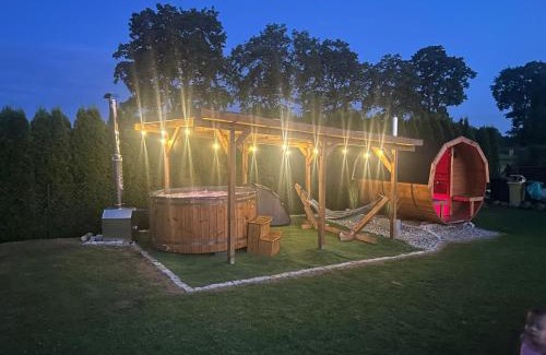 Małdyty Cabin | Discover Domki nad stawem: Oceanfront Retreat with Pool