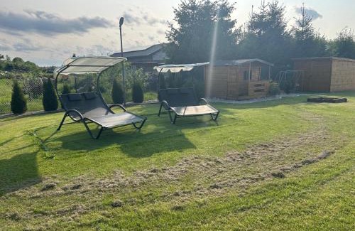 Małdyty Cabin | Discover Domki nad stawem: Oceanfront Retreat with Pool