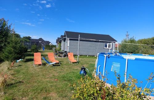 Mscice Cabin | Experience Domki: Oceanfront Retreat with Pool & Pet-Welcome