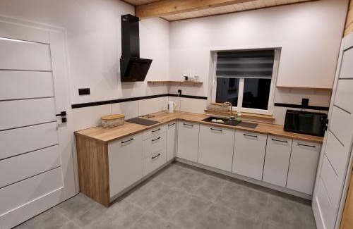 gmina Jozefow House | Oceanfront Escape at Domki Wzgórze Kamień - 9.8 Rated