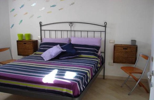 Torre dei Corsari Apartment | Domu Noa: Ocean View Retreat with Family-Friendly Amenities