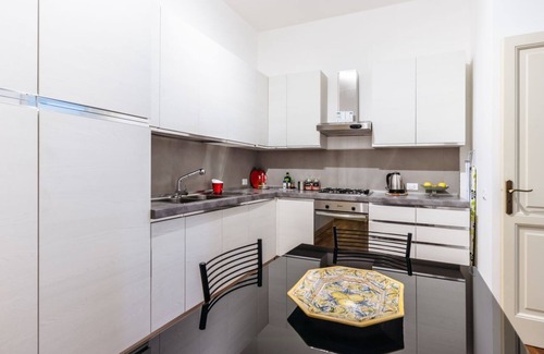Kalsa Apartment | Experience Domus Sicily - Piazza Marina Suite with Garden Views