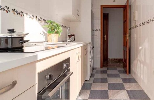 Huelva Apartment | Modern Two-Bedroom Retreat in Central Location with Garage