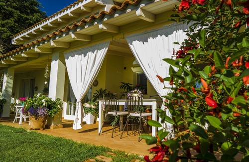 San Teodoro Apartment | Tranquil Double Room Surrounded by Lush Greenery