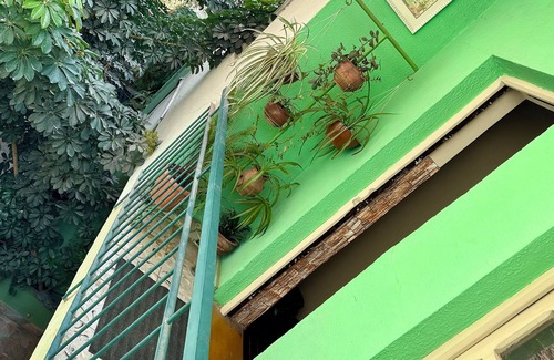 Cochabamba House | Double room with queen size bed and sofa bed, terrace and plants