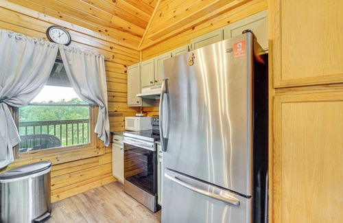 Sevierville Cabin | Charming Lakefront Cabin with Deck and Pool Access