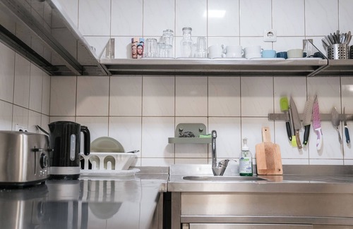 Uzupis House | Discover Downtown Forest Hostel with Family-Friendly Amenities