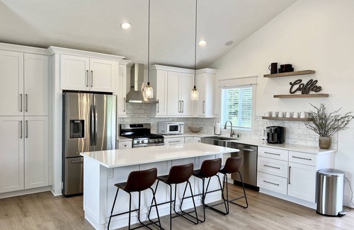 Traverse City House | Dream Palace: Hot Tub, Game Room & Fire Pit near Long Lake