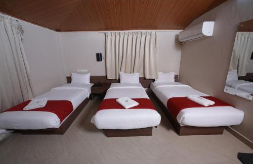 Nedumbassery Cabin | Budget-Friendly Dreams Airport Residency with Breakfast Included