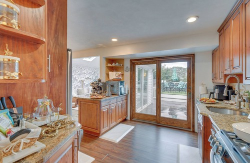 Lake Grove Cottage | Paradise Dreams: Luxury Home with Pool for Families