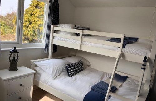 Pagham House | Driftwood Beach House: Pet-Friendly Oceanfront Escape