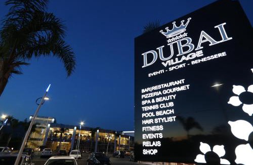Camposano Resort | Discover DubaiVillage: Oceanfront Retreat with Pool & Spa