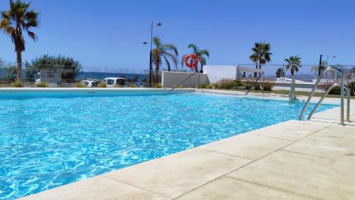 El Morche Apartment | Beachfront Dunas Apartment with Pool & Ocean Views