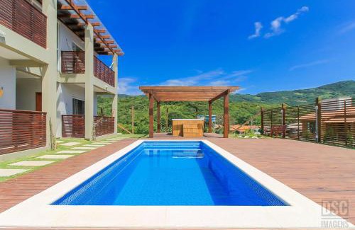 Garopaba Apartment | Pet-Friendly Dunas Studios: Top-Rated Stay with Pool & Hot Tub