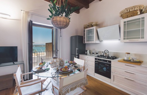 Ortigia Apartment | DuoMo SeaView Design: Oceanfront Retreat with Free WiFi