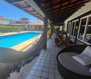 Manguinhos House | Elegant Duplex Geriba with Pool, Sauna & Expansive Yard