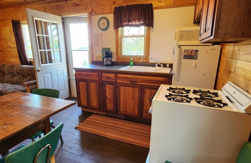 Nevis Resort | Cozy East Crooked Lake Cabin with Pool and Spa