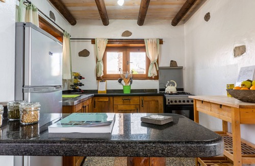 Haria House | Family-Friendly Eco Barn with Pool, Steps from Golden Beach