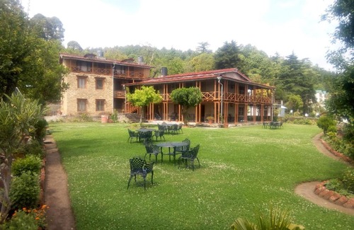 Kausani Cabin | Eco-Friendly Retreat at Vamoose Eco Lodge Chevron