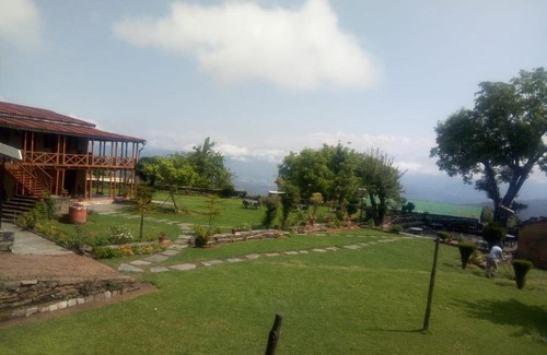 Kausani Cabin | Eco-Friendly Retreat at Vamoose Eco Lodge Chevron