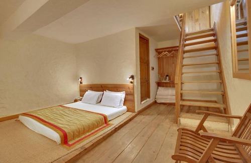 Kausani Cabin | Eco-Friendly Retreat at Vamoose Eco Lodge Chevron