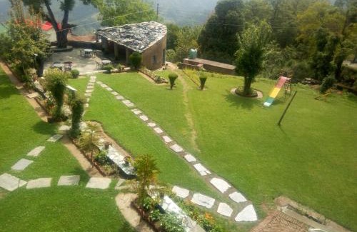Kausani Cabin | Eco-Friendly Retreat at Vamoose Eco Lodge Chevron