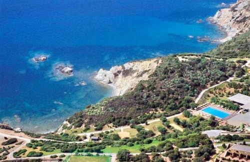 Teulada Apartment | Relaxing Ecovillage with Pool and Private Outdoor Spaces