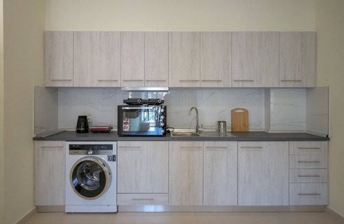 Petaloudes Apartment | Discover Eden's Lily: Sea View Apartment with Spa Amenities
