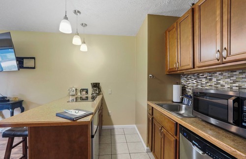 Charlevoix Condo | Discover #102 at Edgewater Inn - Waterfront Retreat Awaits