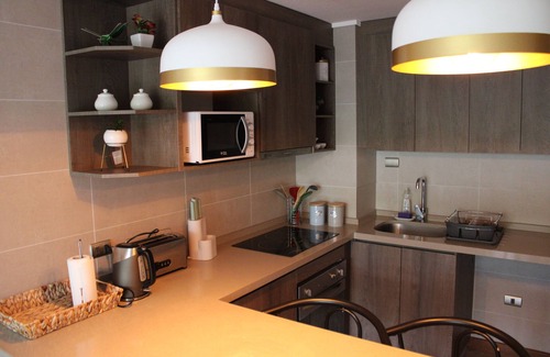 Isla Quinchao Apartment | Elegant Oceanfront Retreat at Edificio B with Spa & Pool