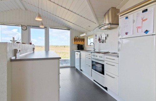 Blavand Strand House | Relax at Edyta: Oceanfront Retreat Steps from the Sea