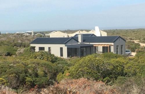 Kleinbaai Villa | EGRETS' ĂRK: Oceanfront Oasis with Private Beach Access