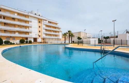 Isla Cristina Apartment | EL CANTIL: Oceanfront Retreat with Pool and Family-Friendly Perks