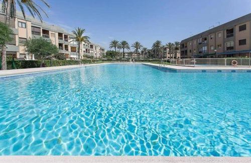Retamar Apartment | Experience El Cuchitril: Oceanfront Haven with Pool
