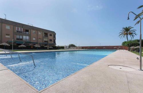 Retamar Apartment | Experience El Cuchitril: Oceanfront Haven with Pool