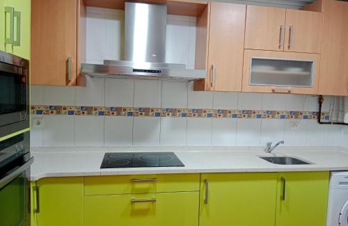 Guarnizo Apartment | Inviting Family Retreat at El Jardín de Nora with Kitchen